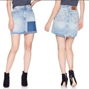 Calvin Klein. Blue Denim Patch Mini Skirt. Size  28.